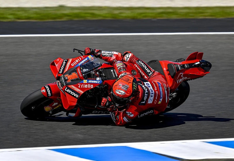 Pecco Bagnaia cornering his Ducati in a Suomy S1-XR GP