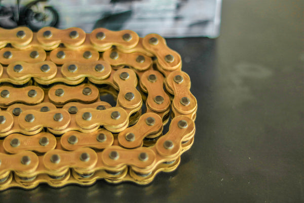 D.I.D 520ZVM-X X-ring chain 520 gold and grey open with rivet link