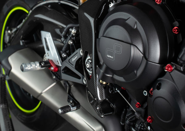 LighTech FTRTR005R rearsets with red brackets and carbon heel guards for Triumph Daytona 675 765