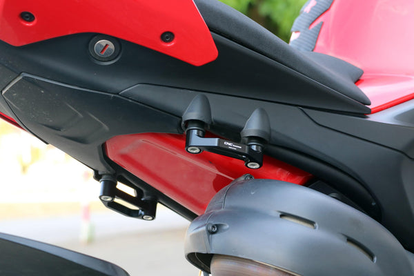 CNC Racing PET52 anodised aluminium pillion footpeg blanking plates for Ducati Panigale V4
