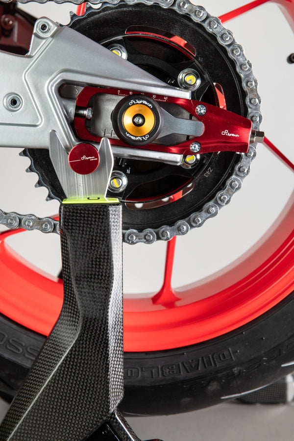 LighTech TEAP004 chain tensioner for Aprilia RS 660 in red and black Ergal 7075 aluminium