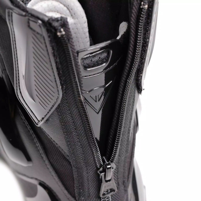Dainese Torque 4 women's motorcycle boots in black, showing Groundtrax sole and magnesium sliders