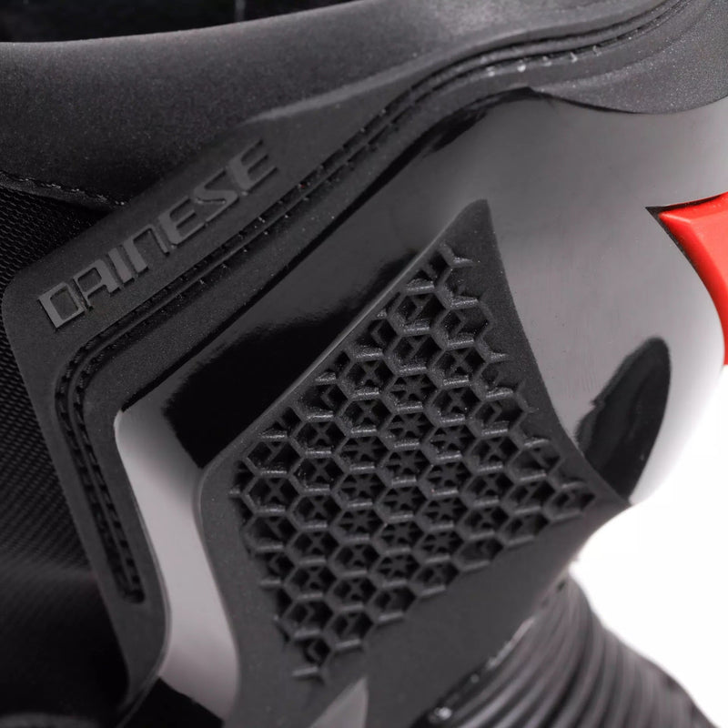 Dainese Torque 4 women's motorcycle boots in black, showing Groundtrax sole and magnesium sliders