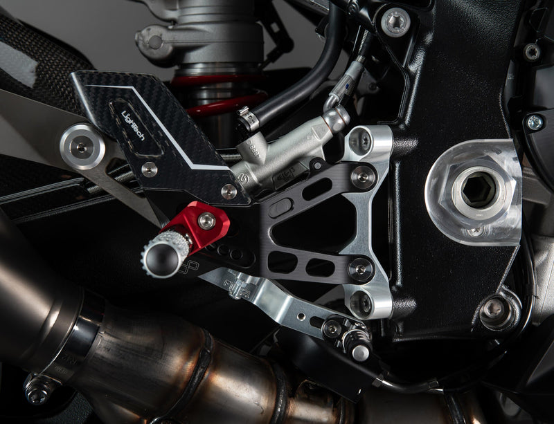 LighTech FTRBM007R rearset R for BMW S1000RR K67, red anodised brackets with silver folding footpegs and carbon heel guards