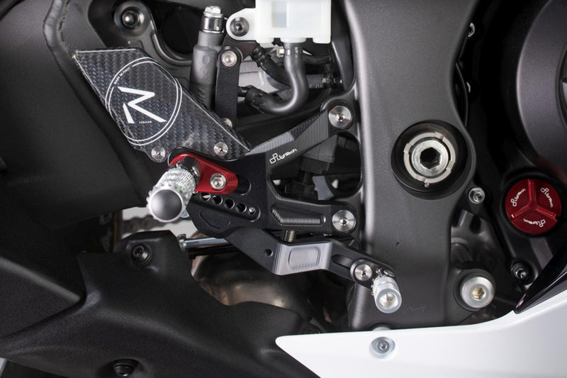 LighTech FTRKA011R rearset kit for Kawasaki ZX-10R ZX-10RR 2021–2026 with red holders and silver folding pegs