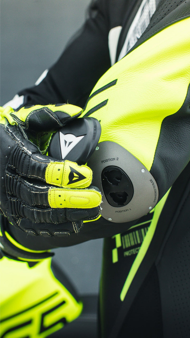 Dainese Audax D-ZIP one-piece leather racing suit in black and neon yellow