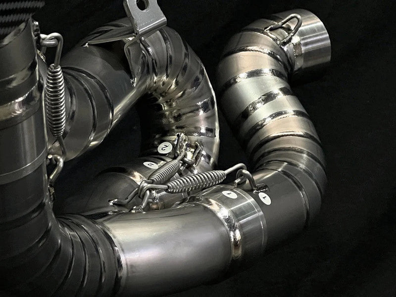 Vandemon Ti1 titanium half-system exhaust with carbon end caps on Ducati Panigale V4