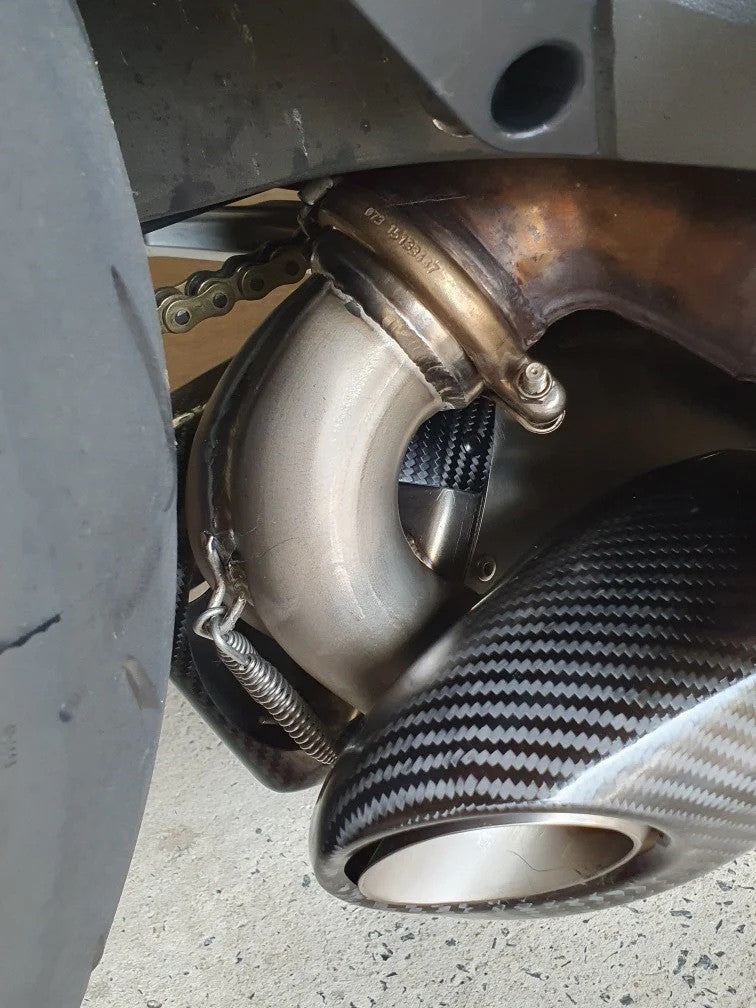 Vandemon Slip-On Low Titanium exhaust system on Ducati Panigale V2 955 with carbon fibre end caps